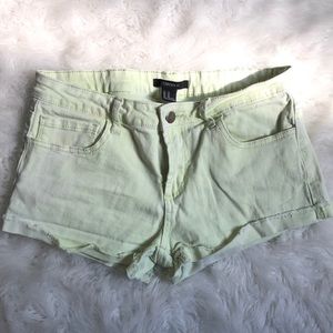 Light washed neon yellow/green shorts
